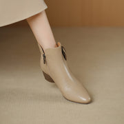 Beige ankle boot on a neutral background